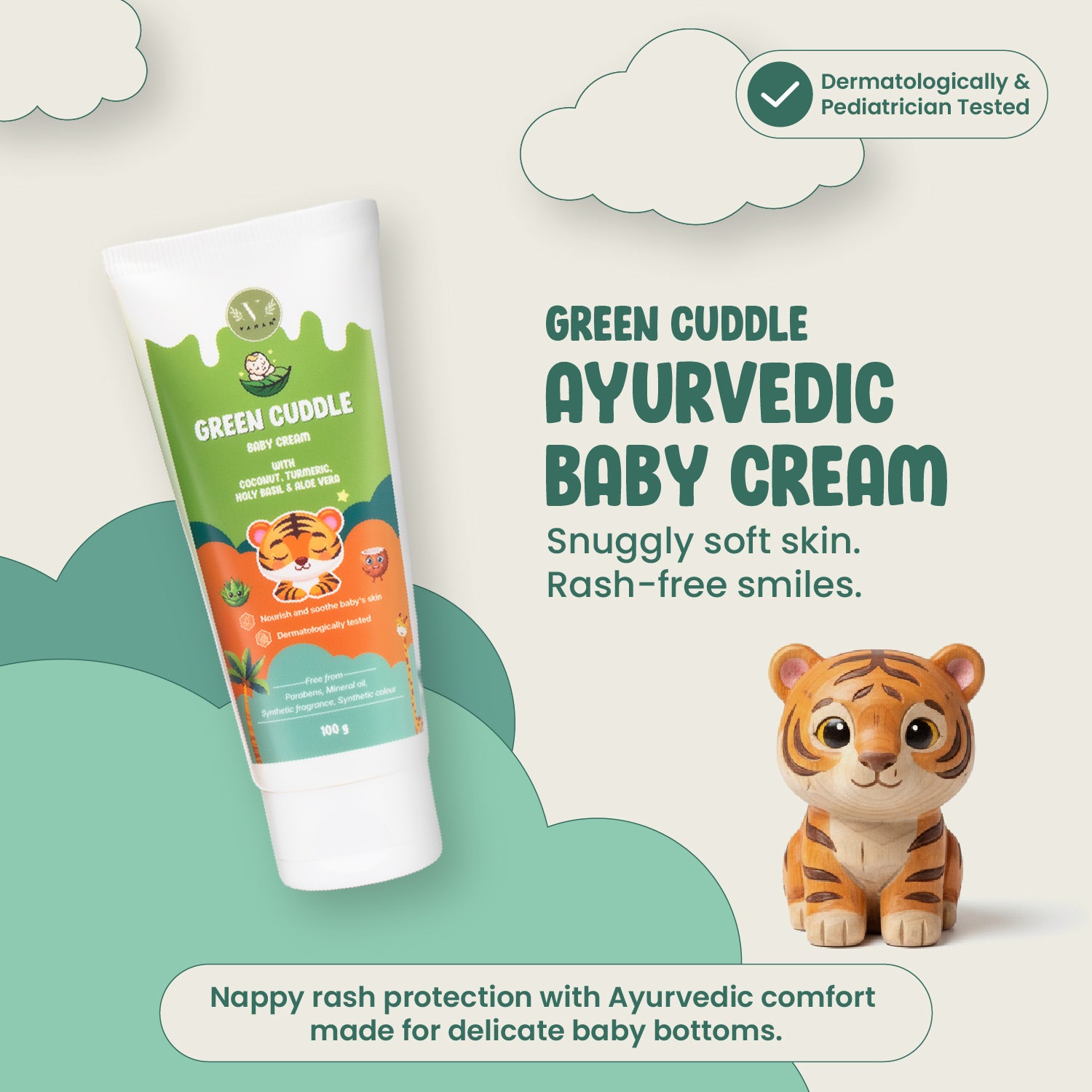 Green Cuddle Ayurvedic Baby Cream with a tiger-themed packaging and toy on a light background