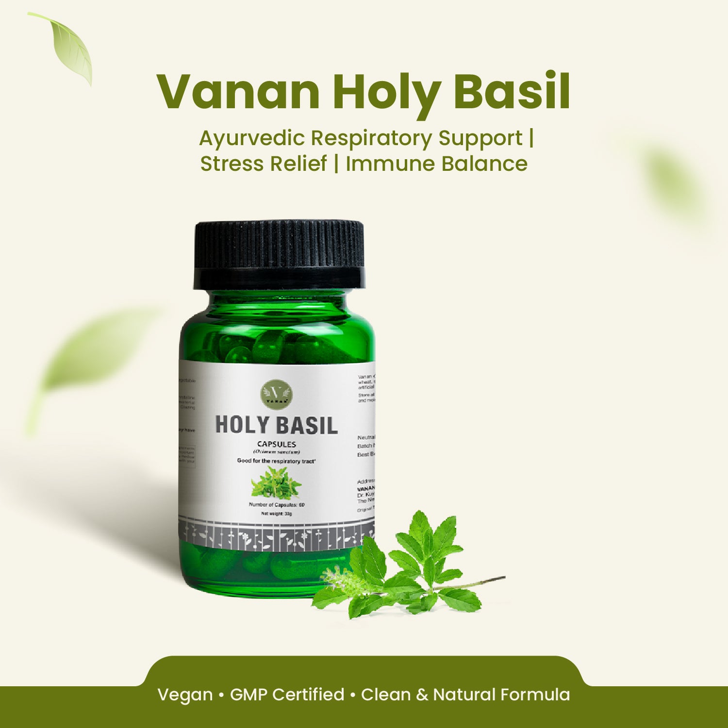 Green bottle of Vanan Holy Basil with leaves on a light background