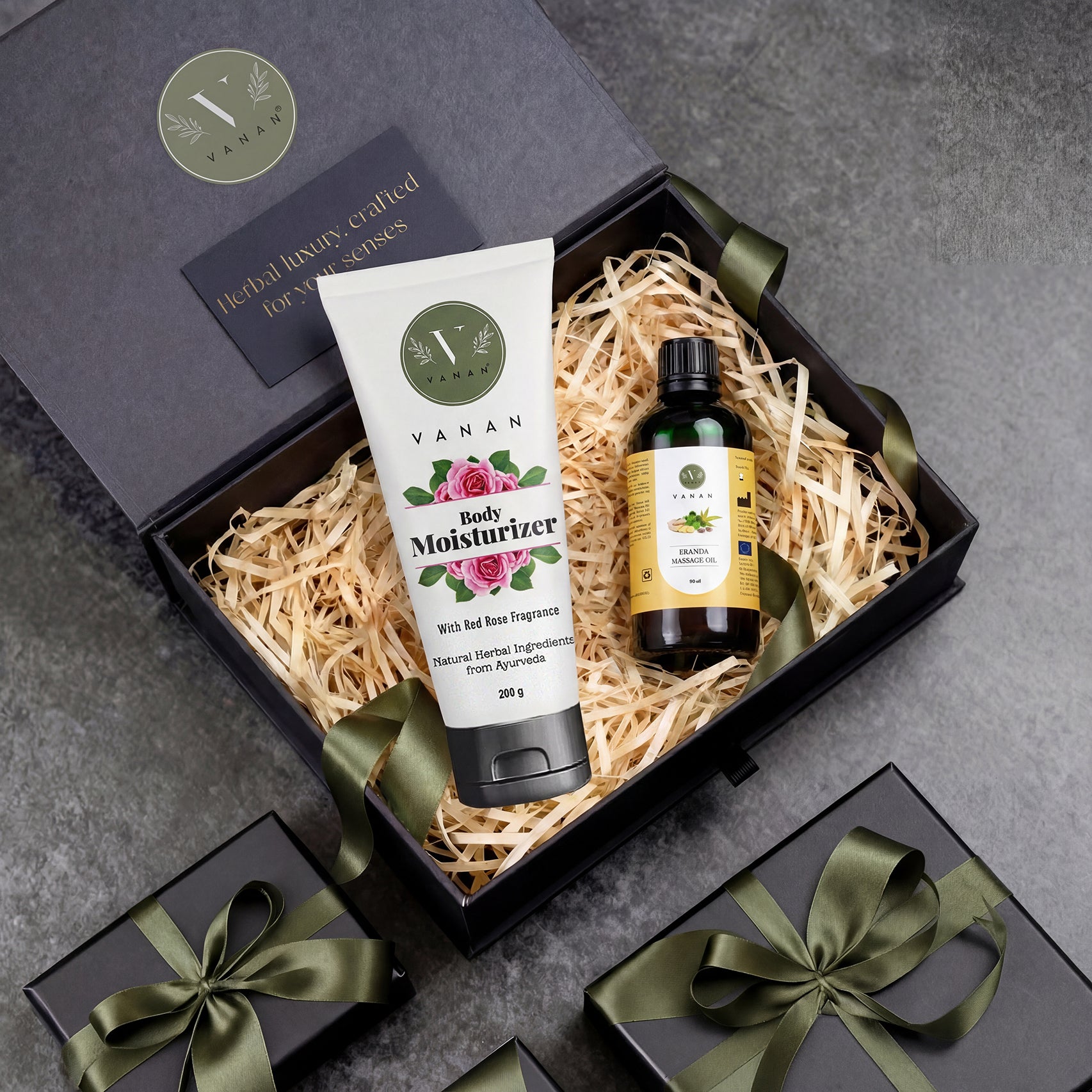 Gift set with Vanan body moisturizer and oil in a decorative box on a gray surface