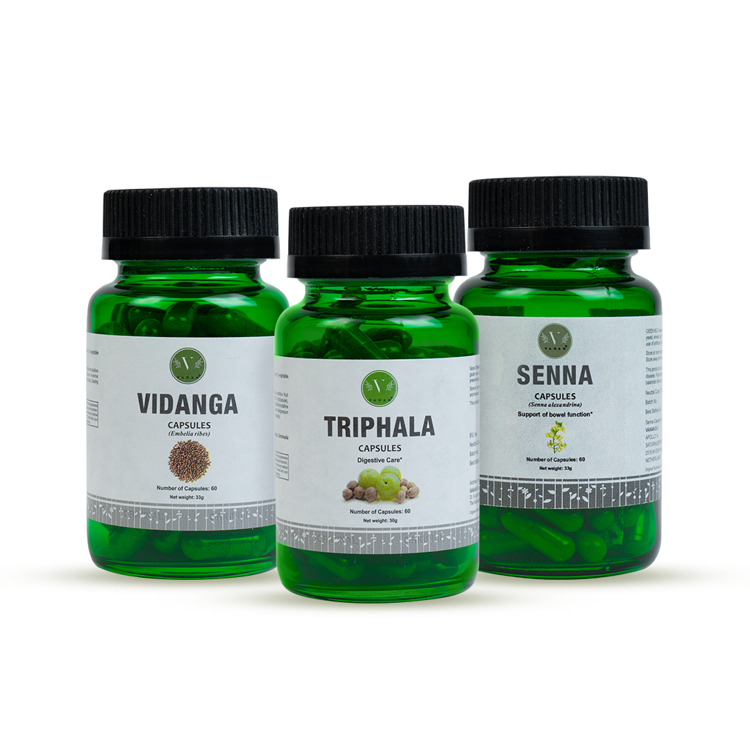 Three green bottles labeled VIDANGA, TRIPHALA, and SENNA, which are dietary supplement capsules.